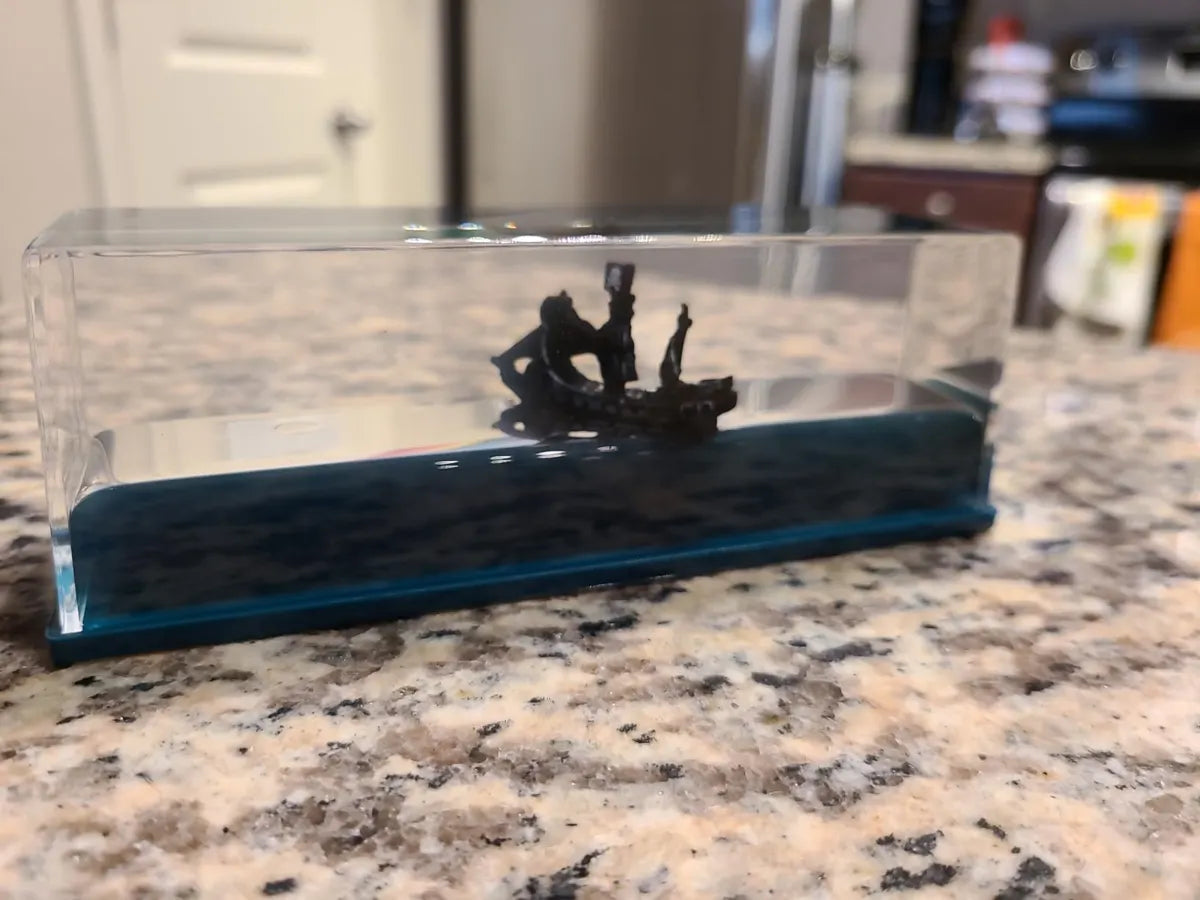 Pirate ship liquid display photographed on a kitchen counter