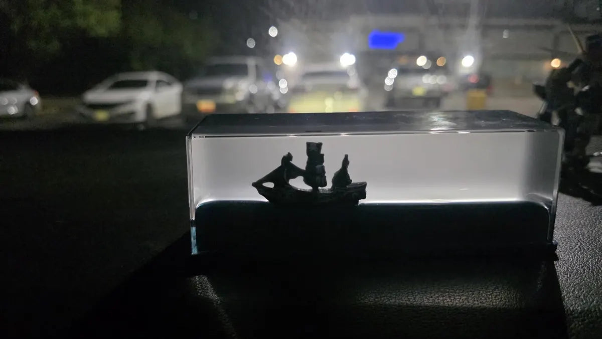 Pirate ship liquid display photographed at night